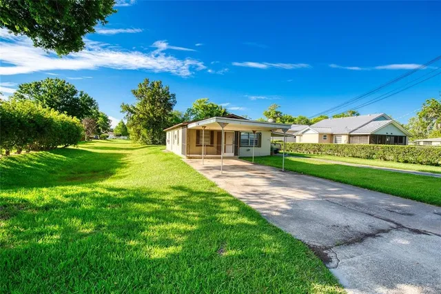 a view of a house with a big yard