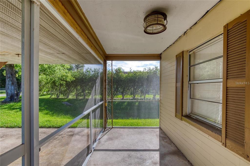 815 8th Street Daytona Beach, FL 32117 - Photo 10 of 50 a view of a room with porch and a floor to ceiling window