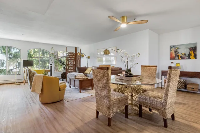 a living room with fireplace furniture and a wooden floor