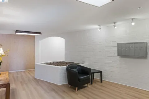 a view of a livingroom with furniture and wooden floor