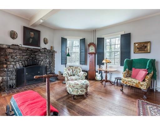 560 Jerusalem Road Cohasset, MA 02025 - Photo 11 of 30 a living room with furniture and a fireplace