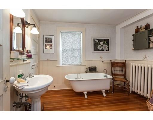 560 Jerusalem Road Cohasset, MA 02025 - Photo 19 of 30 a bathroom with a sink and a mirror