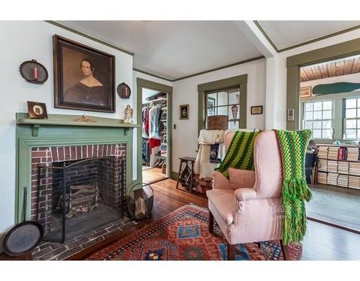 560 Jerusalem Road Cohasset, MA 02025 - Photo 21 of 30 a living room with furniture a flat screen tv and a fireplace