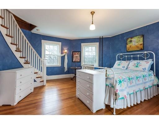 560 Jerusalem Road Cohasset, MA 02025 - Photo 24 of 30 a bedroom with a bed and a large window