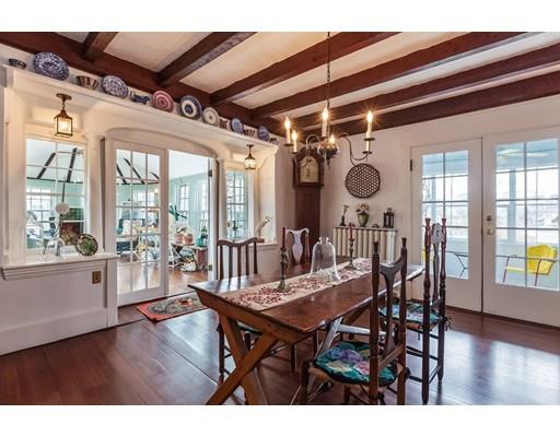 560 Jerusalem Road Cohasset, MA 02025 - Photo 6 of 30 a view of a dining room with furniture wooden floor and chandelier