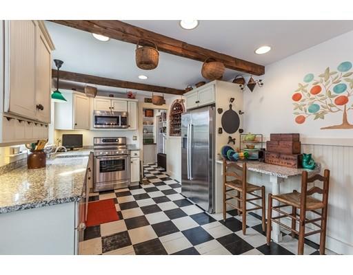 560 Jerusalem Road Cohasset, MA 02025 - Photo 8 of 30 a kitchen with stainless steel appliances kitchen island granite countertop a refrigerator and microwave