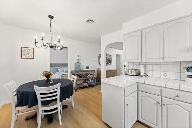 a kitchen with a sink cabinets and refrigerator