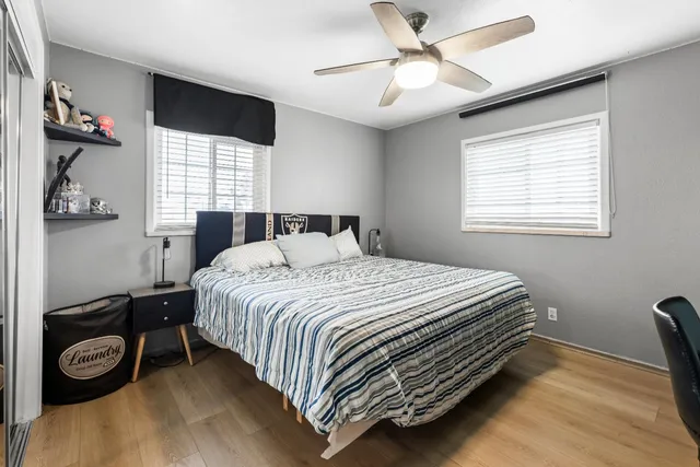 a large bedroom with a bed and furniture