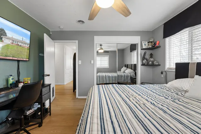 a view of bedroom with a bed and a window