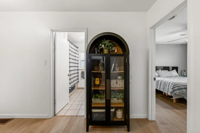 a bathroom with a sink toilet a mirror and shower