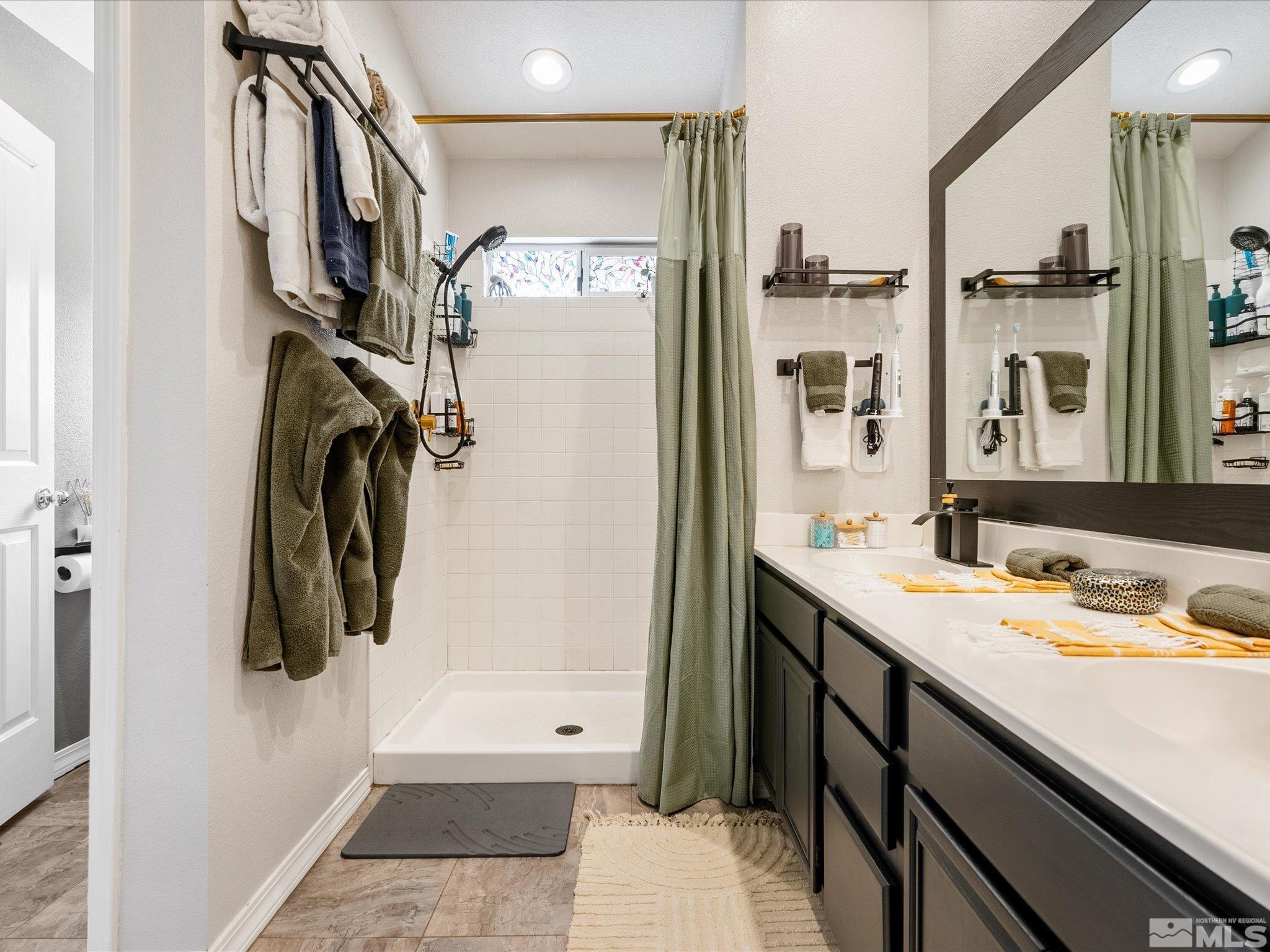 2946 Aspendale Drive Reno, NV 89503 - Photo 19 of 40 a bathroom with a double vanity sink