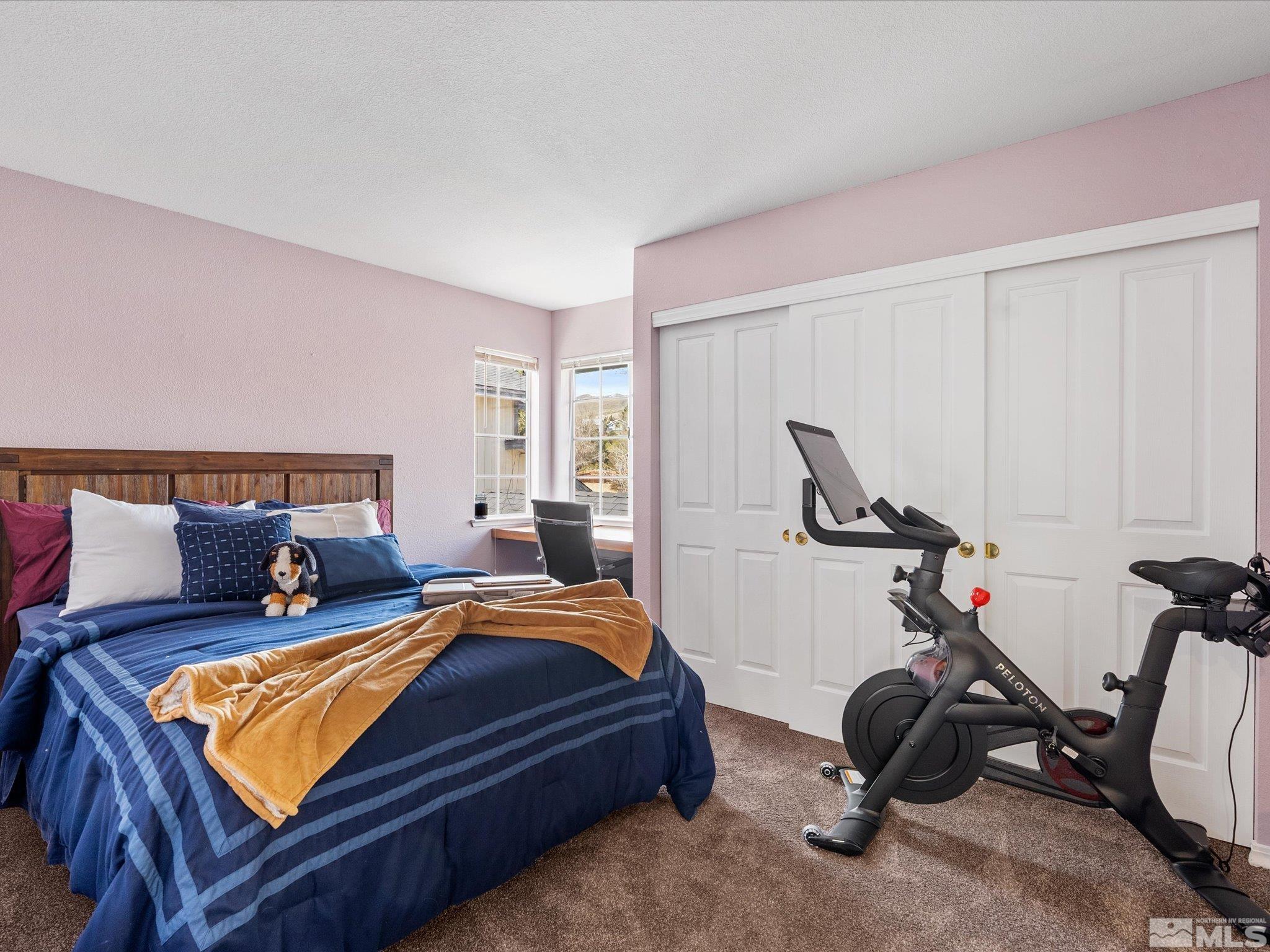 2946 Aspendale Drive Reno, NV 89503 - Photo 21 of 40 a bedroom with bed a desk and chair