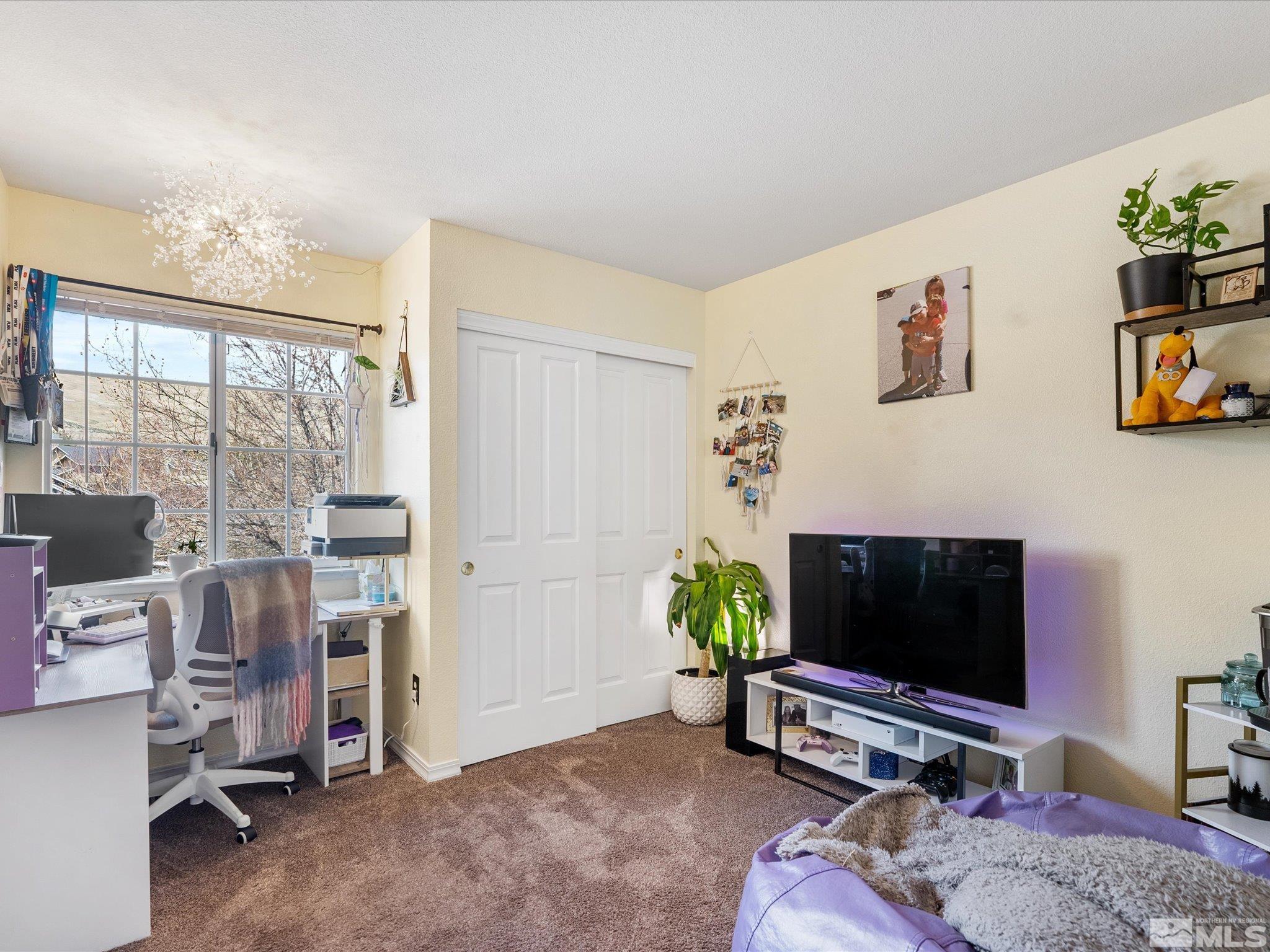 2946 Aspendale Drive Reno, NV 89503 - Photo 22 of 40 a living room with furniture and a flat screen tv