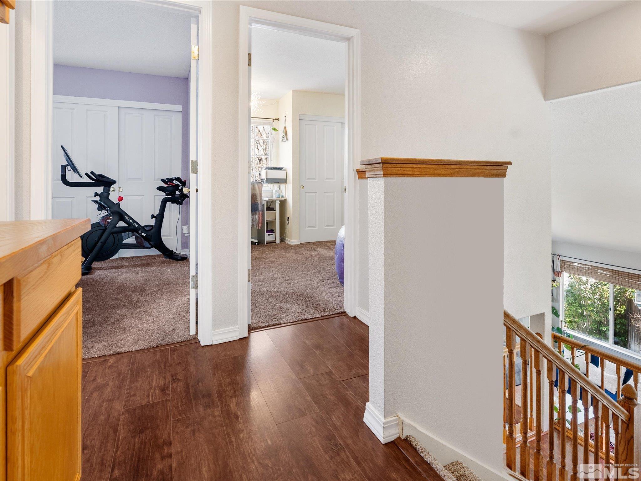 2946 Aspendale Drive Reno, NV 89503 - Photo 24 of 40 a view of a hallway with wooden floor and a livingroom