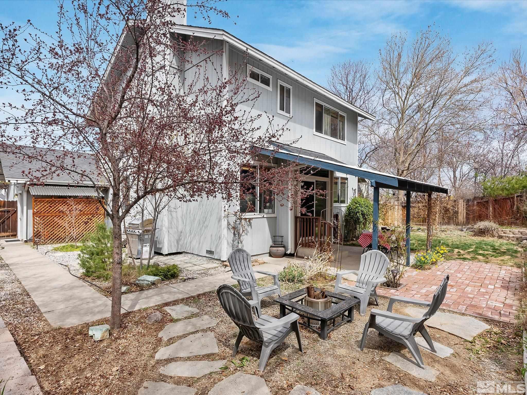 2946 Aspendale Drive Reno, NV 89503 - Photo 33 of 40 a view of a house with backyard sitting area and garden