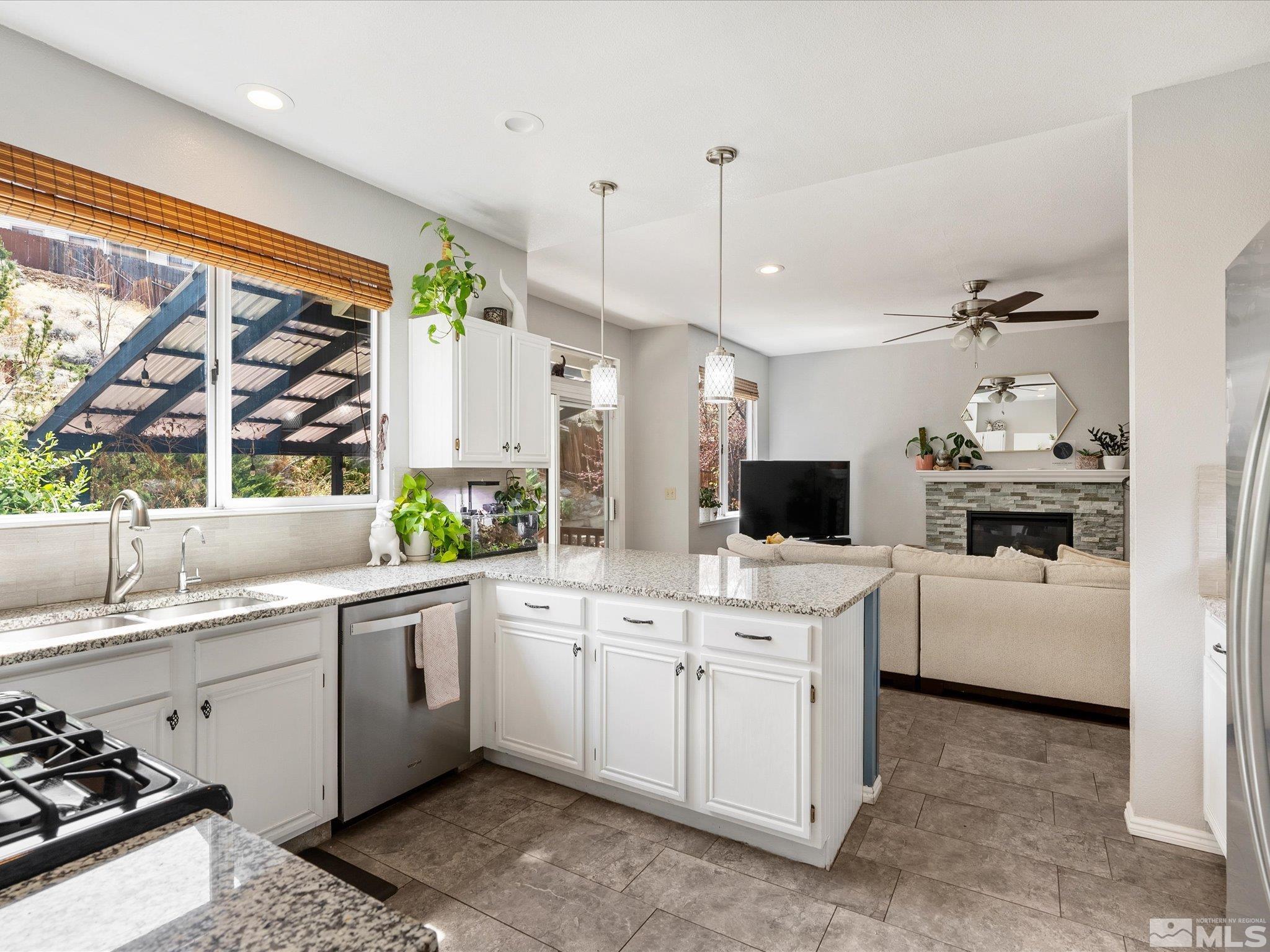 2946 Aspendale Drive Reno, NV 89503 - Photo 10 of 40 a kitchen with a sink stove and cabinets