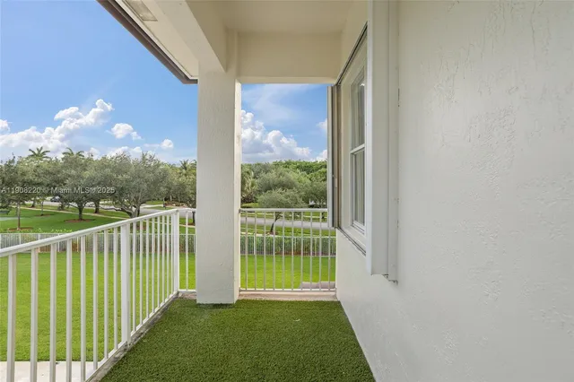 a view of a porch and garden