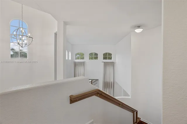 a view of a hallway with windows