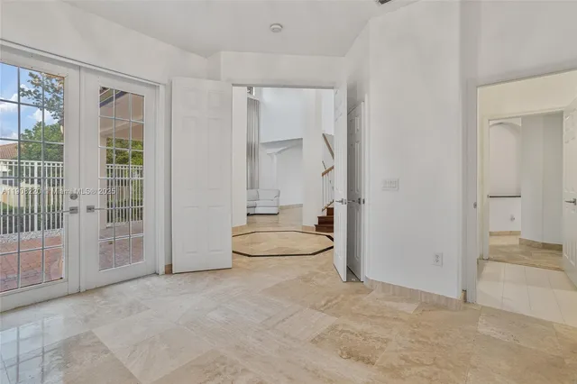 a spacious bathroom with a tub shower and sink