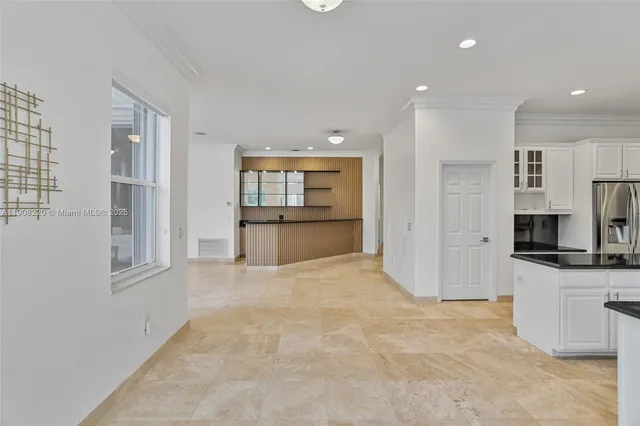a view of a kitchen with a sink and cabinets