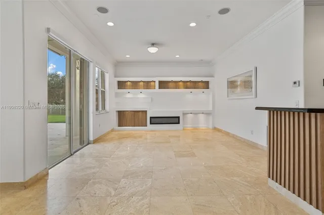a view of empty room with a fireplace