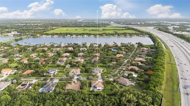 an aerial view of a house with outdoor space lake view and lake view