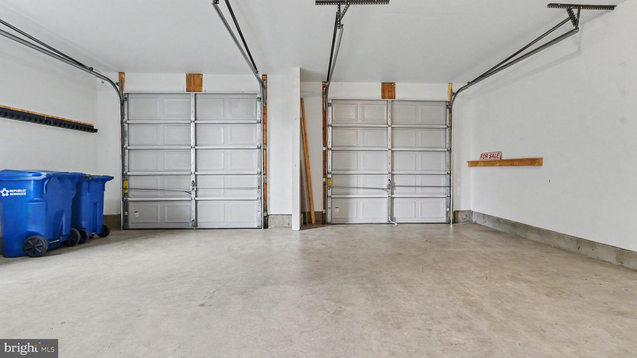 42371 Trellis Square Brambleton, VA 20148 - Photo 5 of 70 Spacious garage with dual doors.