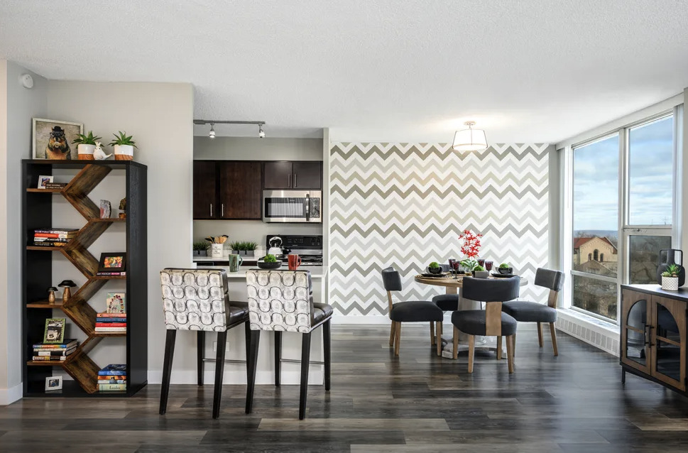 5600 North Sheridan Road, Unit 4A Chicago, IL 60660 - Photo 4 of 14 a view of a dining room with furniture one side kitchen view and wooden floor