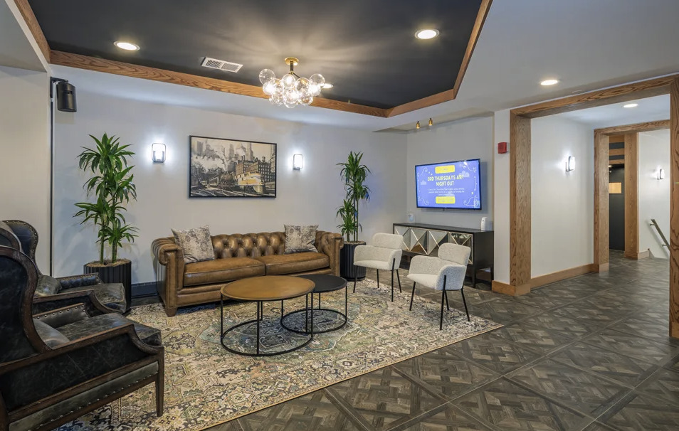5600 North Sheridan Road, Unit 4A Chicago, IL 60660 - Photo 6 of 14 a living room with furniture and a chandelier