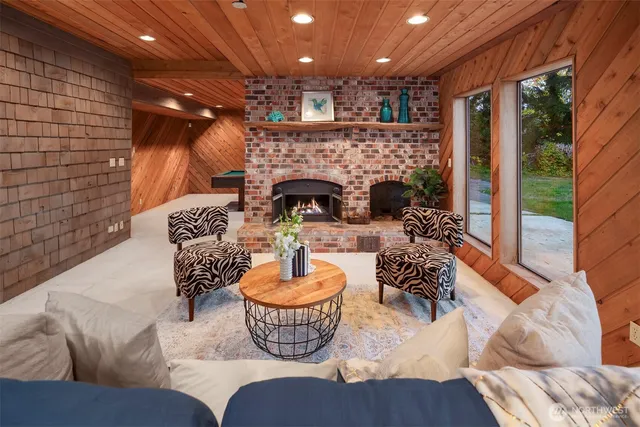 a outdoor living space with furniture and a fireplace