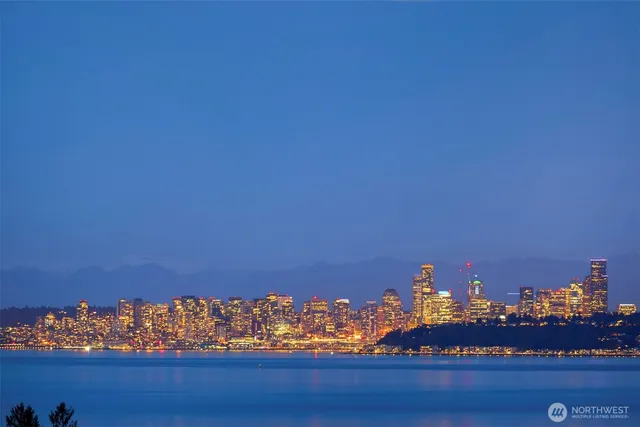 a view of a lake with a large building in the background