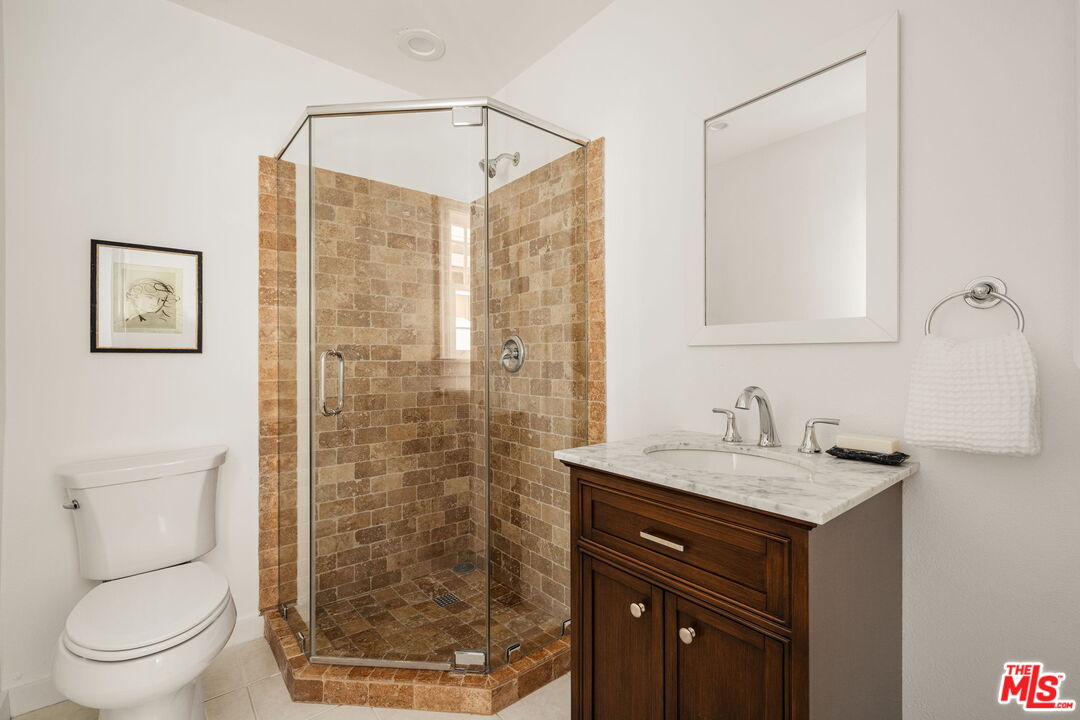 1667 Allen Avenue Pasadena, CA 91104 - Photo 16 of 50 a bathroom with a sink a toilet and shower