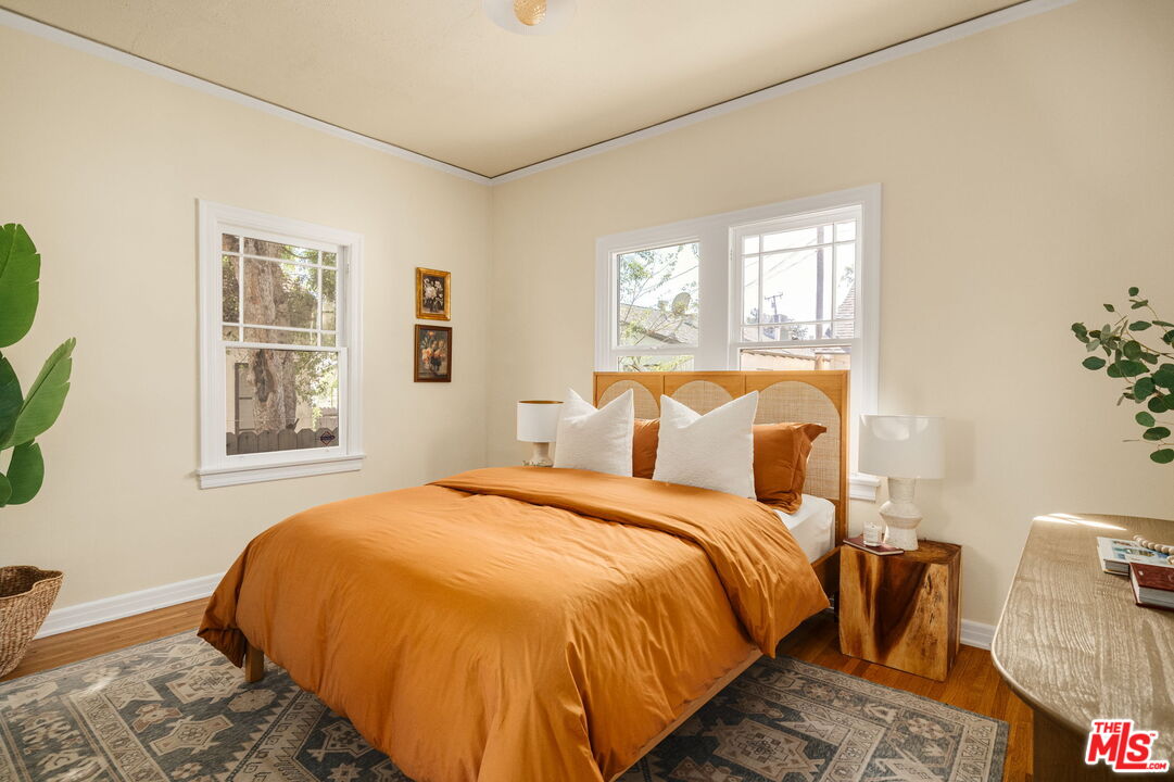 1667 Allen Avenue Pasadena, CA 91104 - Photo 20 of 50 a bed sitting in a bedroom next to a window
