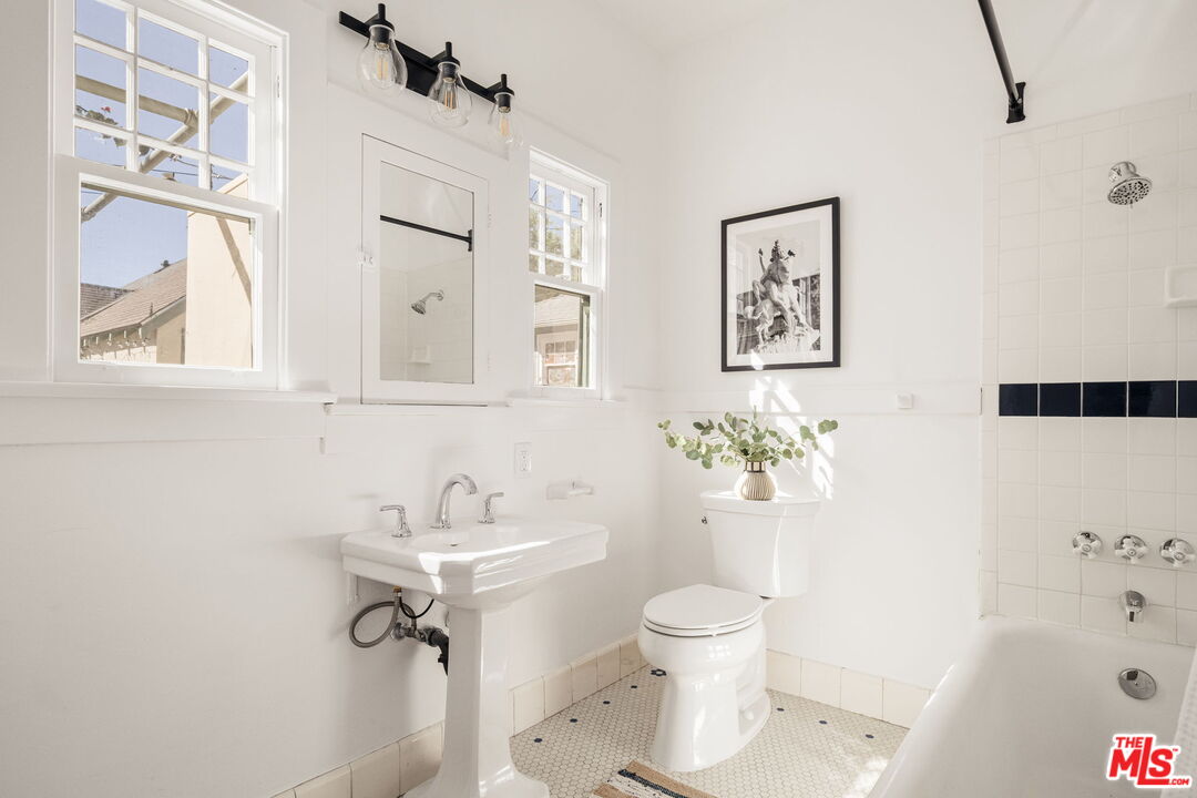 1667 Allen Avenue Pasadena, CA 91104 - Photo 22 of 50 a bathroom with a sink toilet and shower