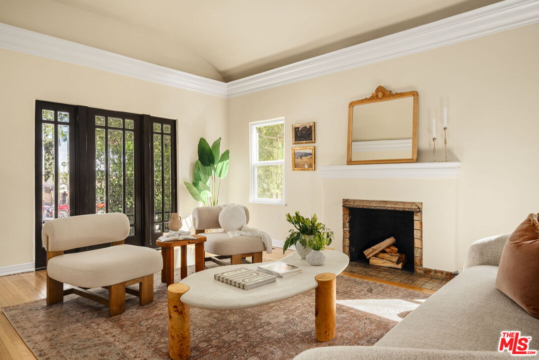 1667 Allen Avenue Pasadena, CA 91104 - Photo 8 of 50 a living room with furniture and a fireplace