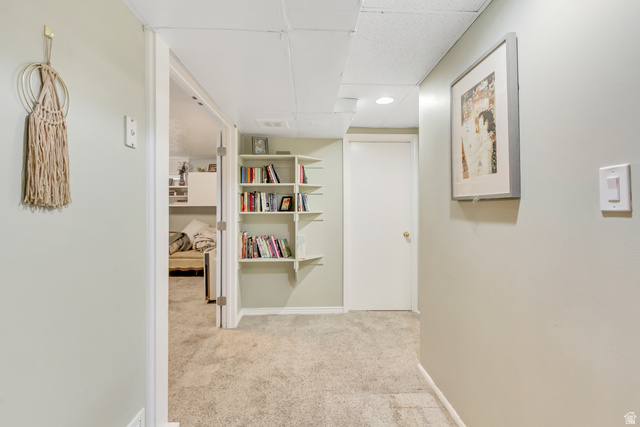 65 West 700 North Bountiful, UT 84010 - Photo 25 of 29 Hallway with plush carpeting, recessed lighting, built-in shelving, and white interior doors