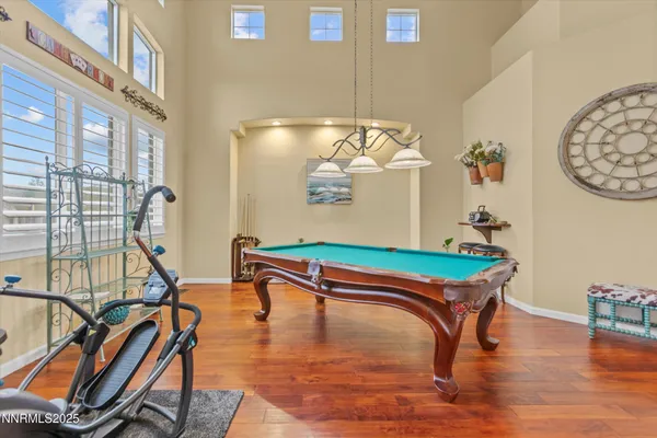 a large kitchen with a table and chairs