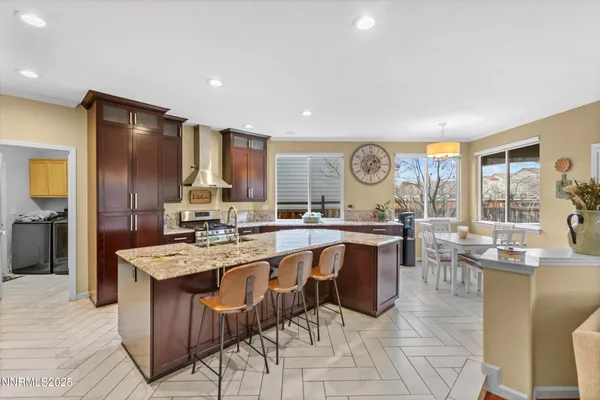 a kitchen with granite countertop lots of counter top space and stainless steel appliances