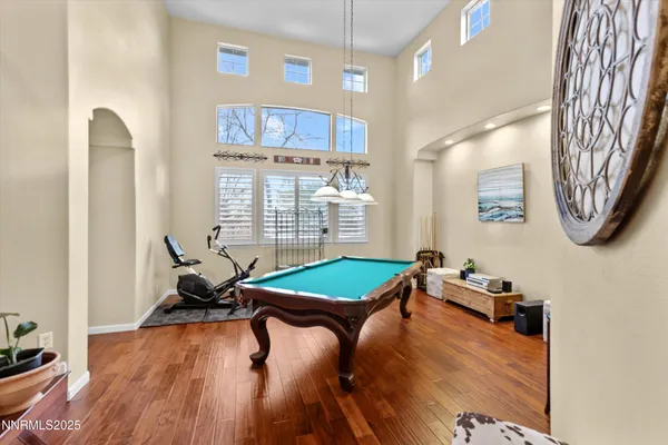 a room with musical instruments and wooden floor
