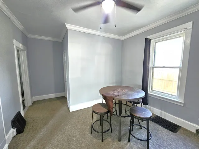 a view of a room with furniture window and wooden floor