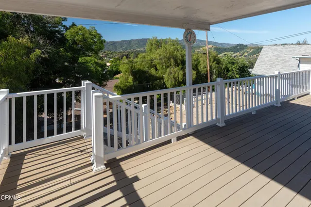 a view of a balcony with a street view