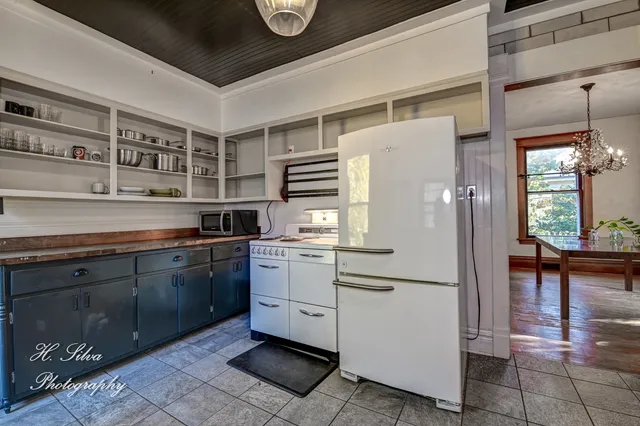 a kitchen with stainless steel appliances a refrigerator and cabinets
