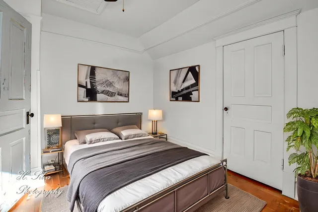 a white toilet sitting next to a bathroom sink