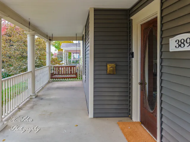 a view of porch with wooden floor