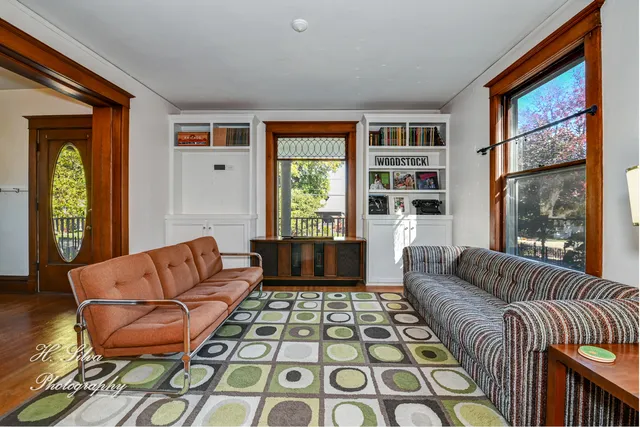 a living room with furniture and a rug
