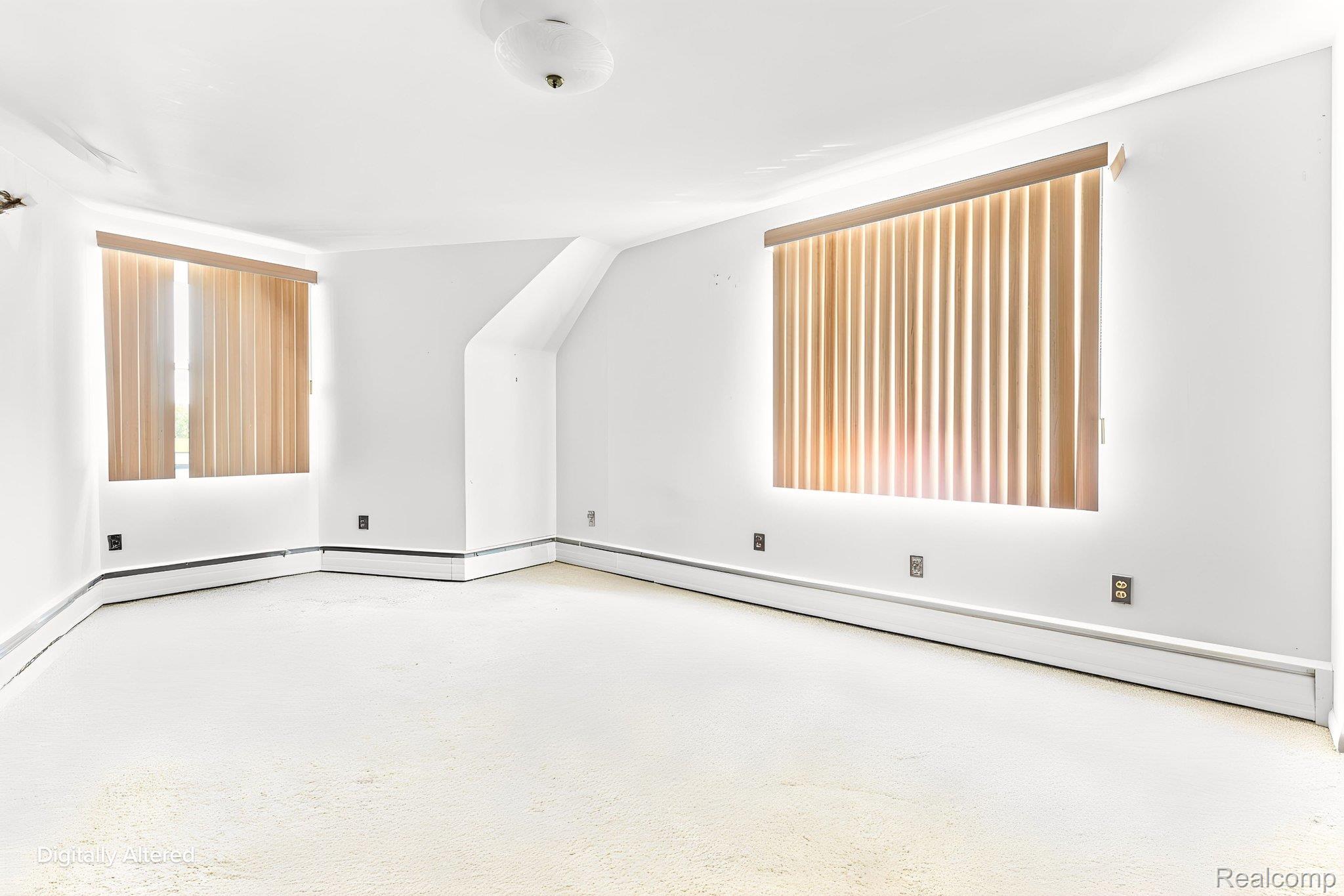 9735 Dolan Road Columbus, MI 48063 - Photo 36 of 63 Spacious room featuring light-toned carpeting and multiple windows with vertical blinds