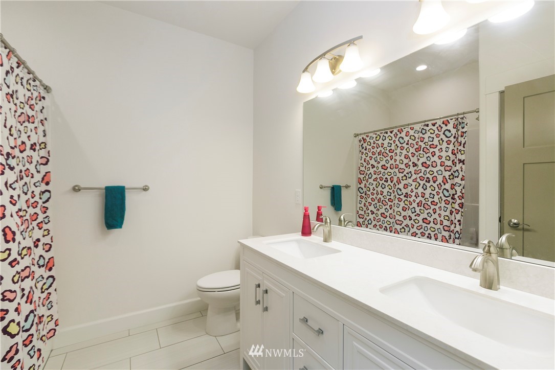 11301 Stump Road Yakima, WA 98908 - Photo 22 of 24 a bathroom with a sink a toilet and shower