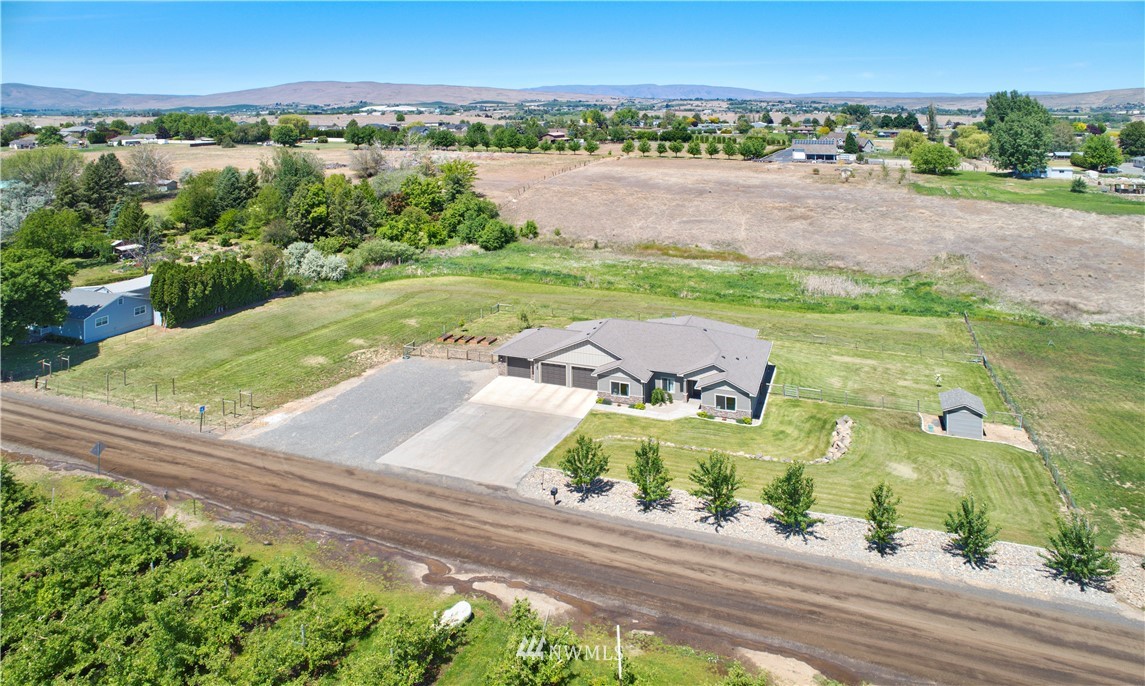 11301 Stump Road Yakima, WA 98908 - Photo 6 of 24 an aerial view of a house with a garden and lake view