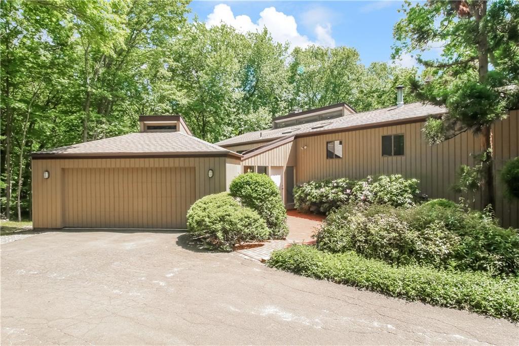 197 Rimmon Road Woodbridge, CT 06525 - Photo 1 of 1 a front view of a house with garden