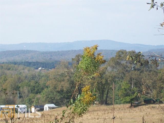 3192 Kesler Road, Unit 14 Carnesville, GA 30521 - Photo 1 of 1 an aerial view of a house with a yard and mountain view